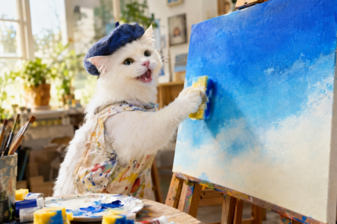 白猫の画家がスポンジを使って、ぽんぽんと!キャンバスに空のグラデーションを描いている。楽しそう!